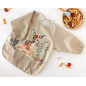 BABERO IMPERMEABLE CON MANGAS CIERVO BEIGE-KIOKIDS